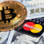 Bitcoin,Cryptocurrency,And,Mastercard,Cards,With,Money,,Dollars,Closeup.,Mastercard